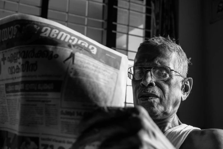 a black and white photo of a man reading a newspaper, a picture, pexels contest winner, malayalis attacking, an oldman, 15081959 21121991 01012000 4k, :: morning