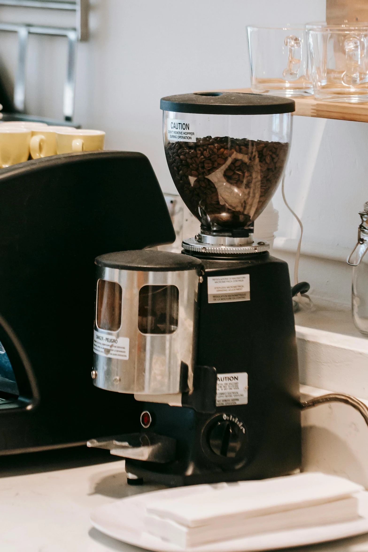 a coffee grinder sitting on top of a counter, profile image, thumbnail, well - appointed space, at checkout