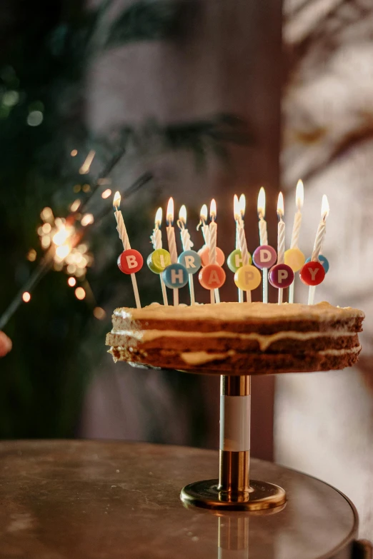 a birthday cake sitting on top of a table, pexels, happy birthday candles, majestic light, ilustration, multiple stories