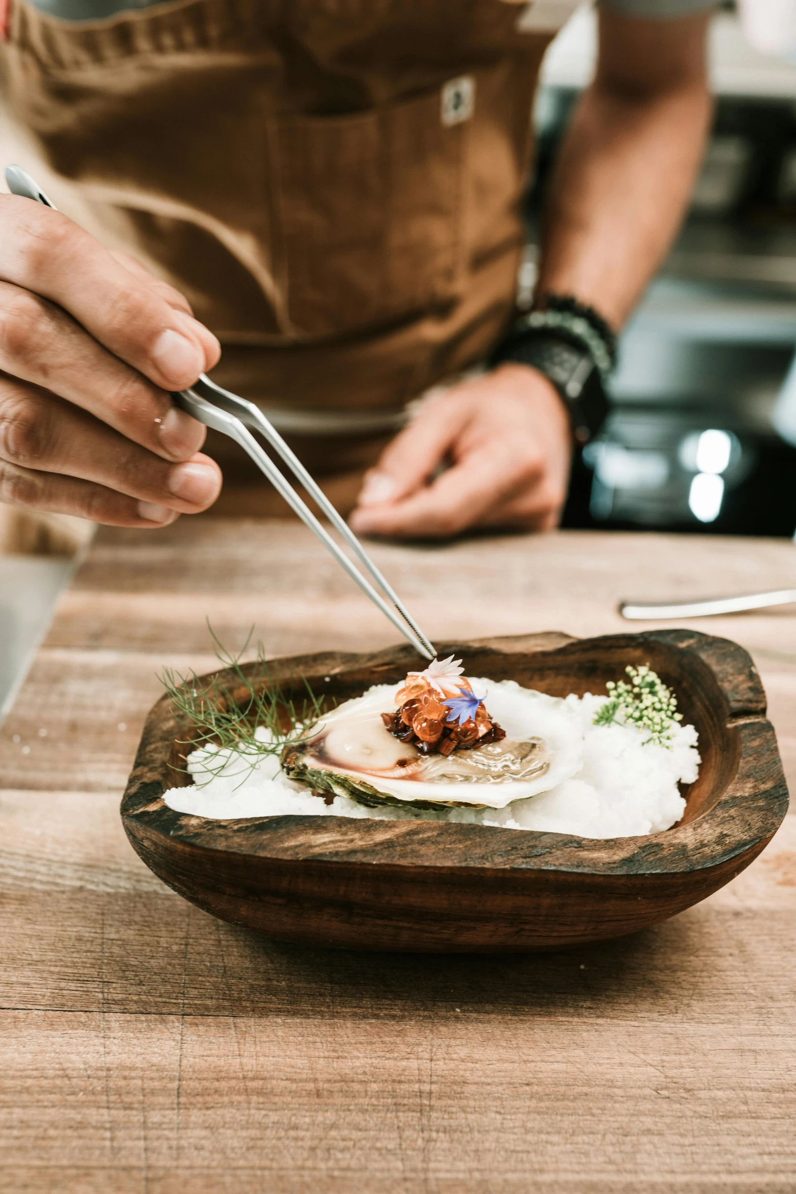 a close up of a plate of food on a table, a portrait, inspired by Barthélemy Menn, unsplash, holding a wood piece, cooking it up, blending, chef platypus