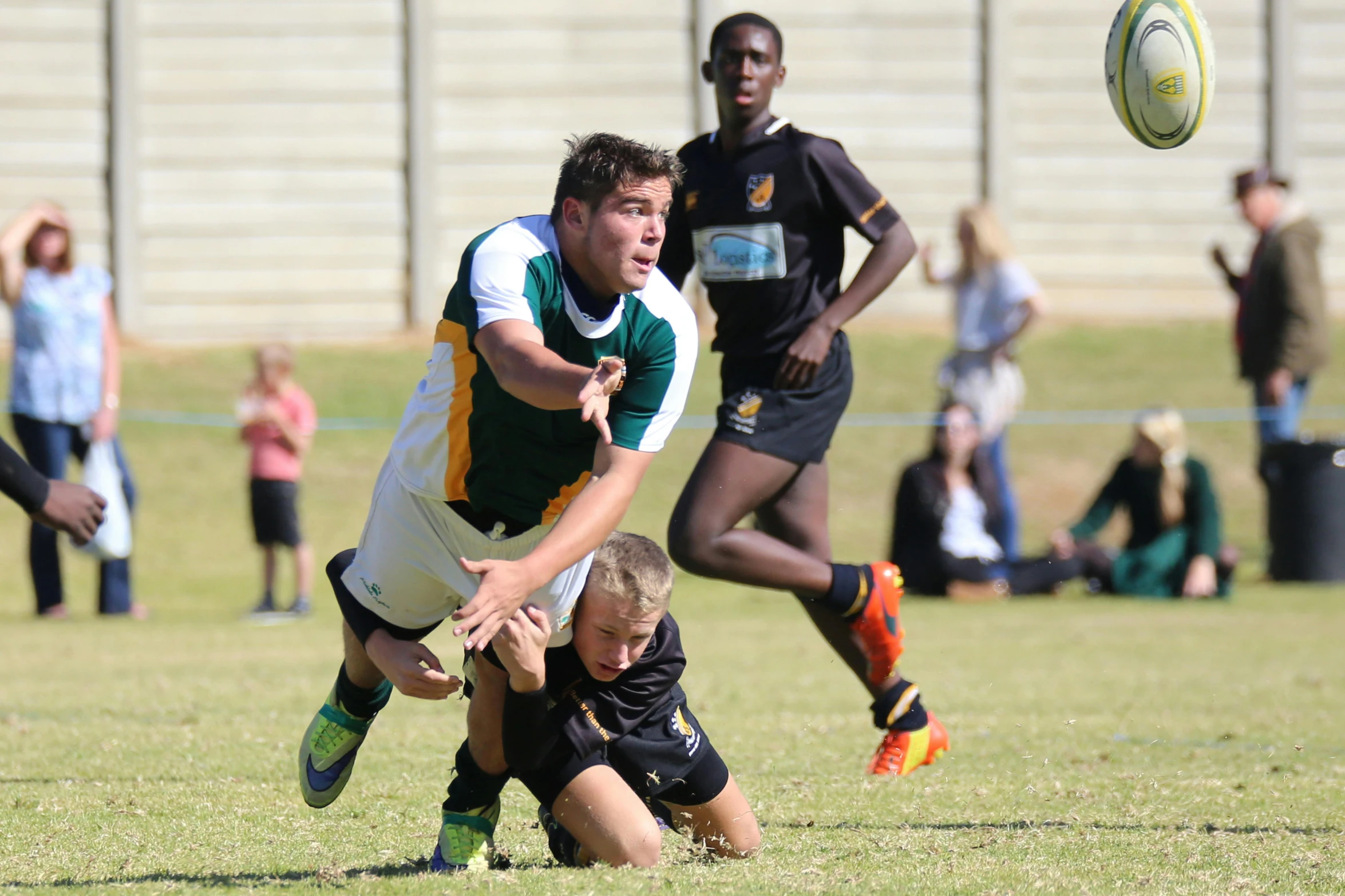 a group of young men playing a game of rugby, by Hubert van Ravesteyn, pexels contest winner, athletic footage, mid action, 15081959 21121991 01012000 4k, panoramic shot