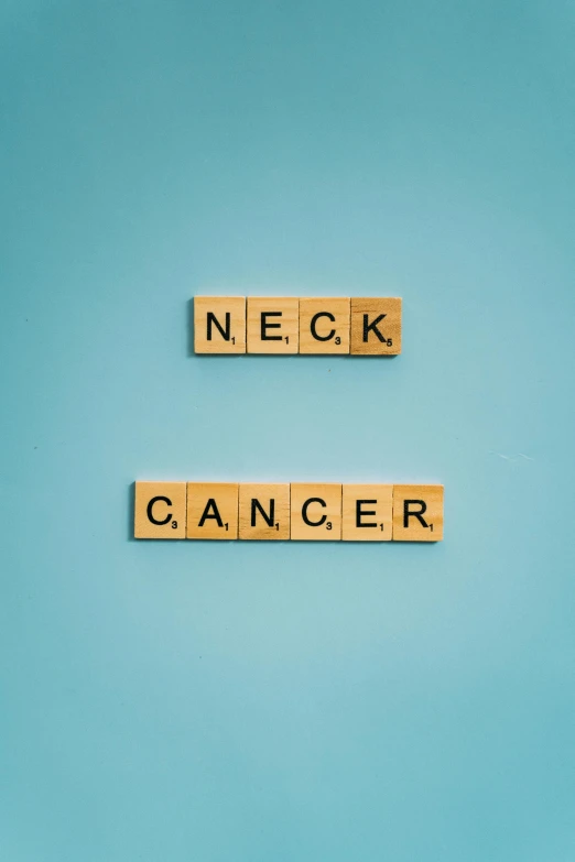 the words neck cancer spelled in scrabbles on a blue background, an album cover, by Eglon van der Neer, trending on pexels, neo-figurative, collar around neck, a wooden, a green, gray