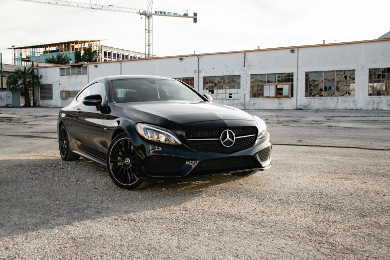 a black car parked in front of a building, a portrait, mercedez benz, ultrawide lens”, sharp focus », carson ellis