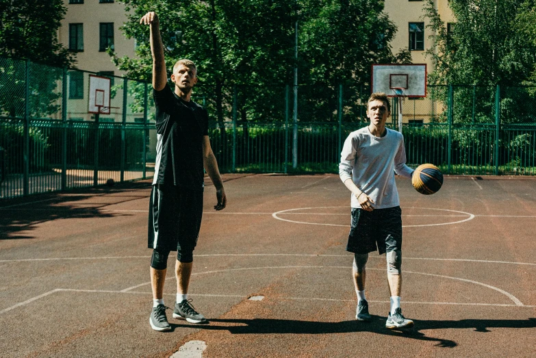 a couple of men standing on top of a basketball court, by Matija Jama, dribble, daniil kudriavtsev, looking towards the camera, giant threes, 15081959 21121991 01012000 4k