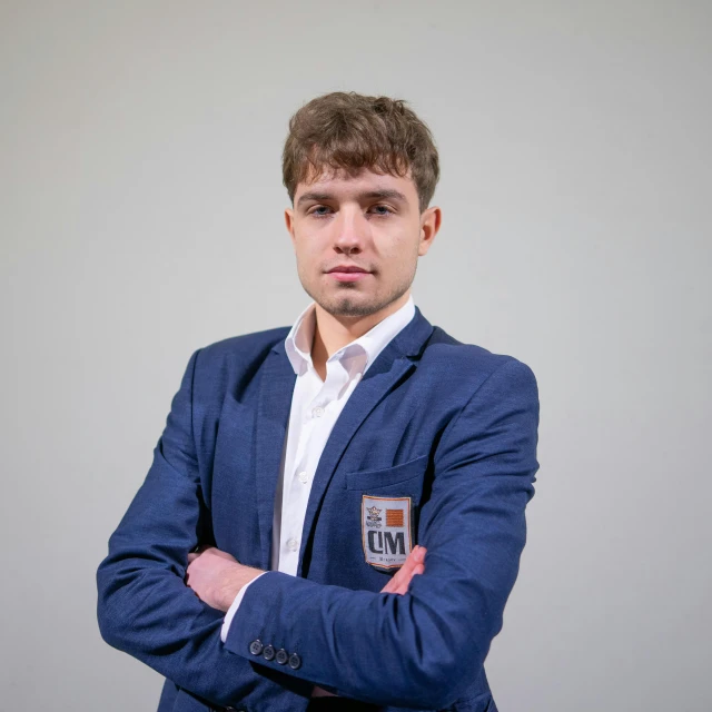 a man in a suit standing with his arms crossed, by Simon Ushakov, reddit, magnus carlsen, avatar image, ukraine. professional photo, professional profile photo