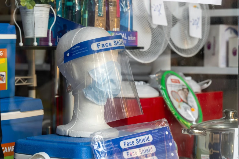 a close up of a mannequin in a store, a portrait, pexels, plasticien, visor screen for face, at the counter, blue, cone heads