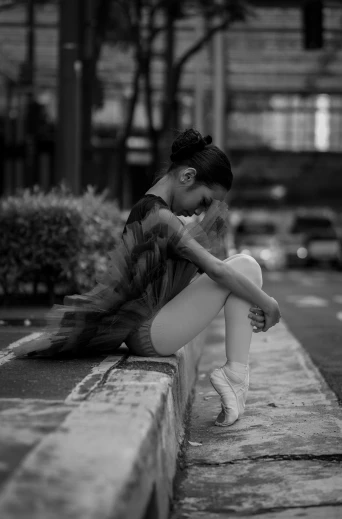a black and white photo of a woman sitting on a curb, by Elizabeth Polunin, cinematic. by leng jun, girl graceful, devastated, 15081959 21121991 01012000 4k