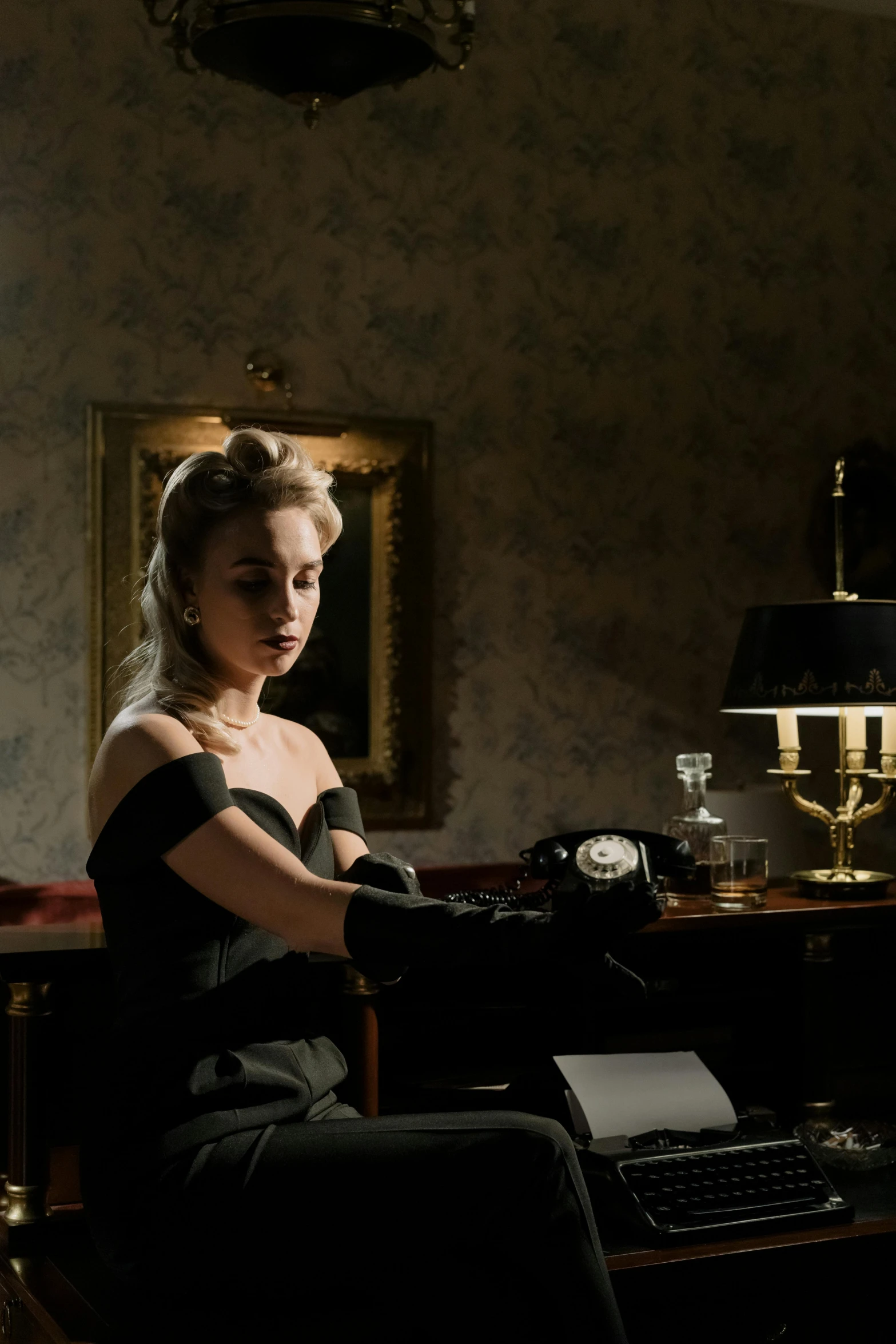 a woman sitting at a desk with a typewriter, a portrait, inspired by Albert Edelfelt, margot robbie as catwoman, [ theatrical ], slide show, elegant atmosphere