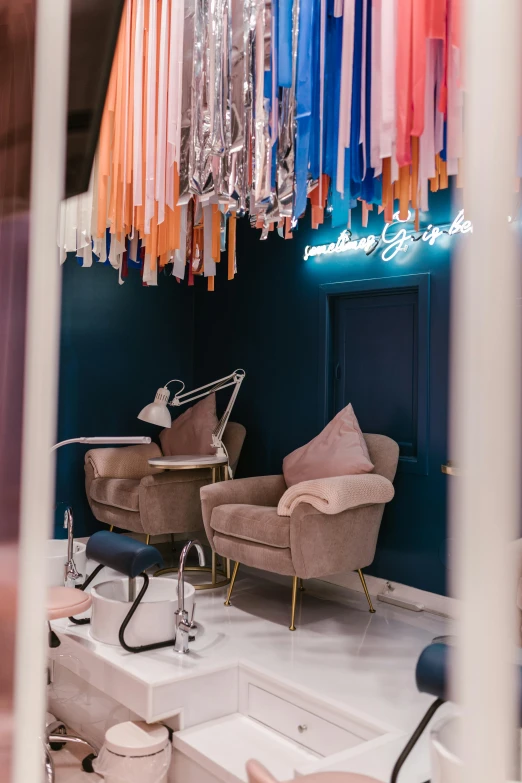 a room that has a bunch of chairs in it, by Arabella Rankin, trending on unsplash, maximalism, pink and blue lighting, between two chairs over a toilet, shop front, silver and blue color schemes