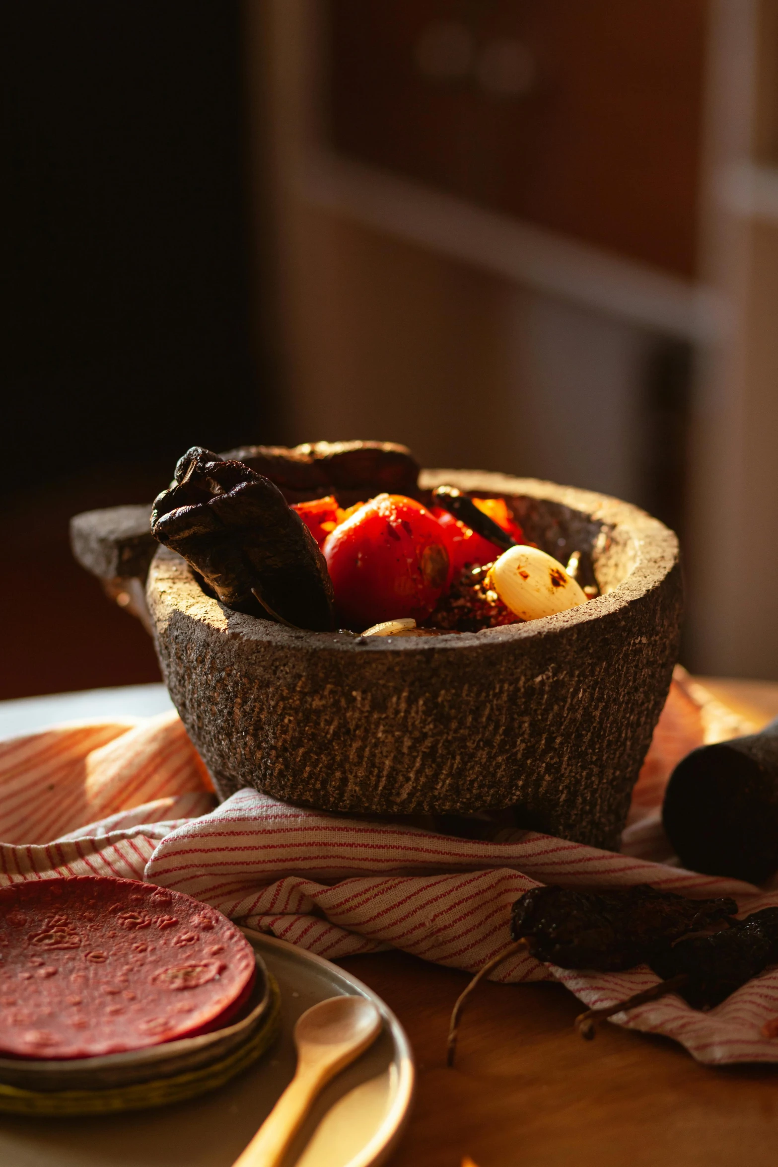 a bowl of fruit sitting on top of a table, volcanic embers, pestle, detailed product image, horned