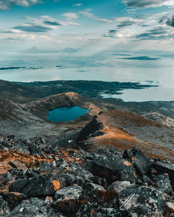 a large body of water sitting on top of a mountain, by Alexander Runciman, unsplash contest winner, hurufiyya, hamar, found on a volcano, thumbnail, multiple stories