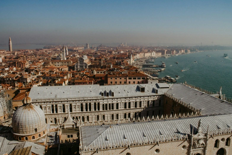 a view of a city from the top of a building, by Canaletto, pexels contest winner, renaissance, venice biennale's golden lion, profile image, aerial footage, 2022 photograph