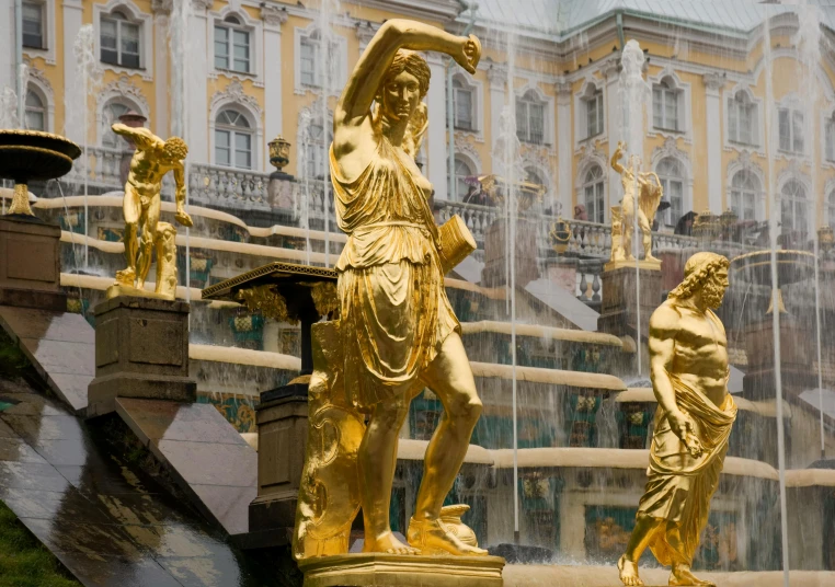 a couple of statues sitting in front of a fountain, by Fyodor Rokotov, pexels contest winner, rococo, sculpture made of gold, slide show, square, 2995599206