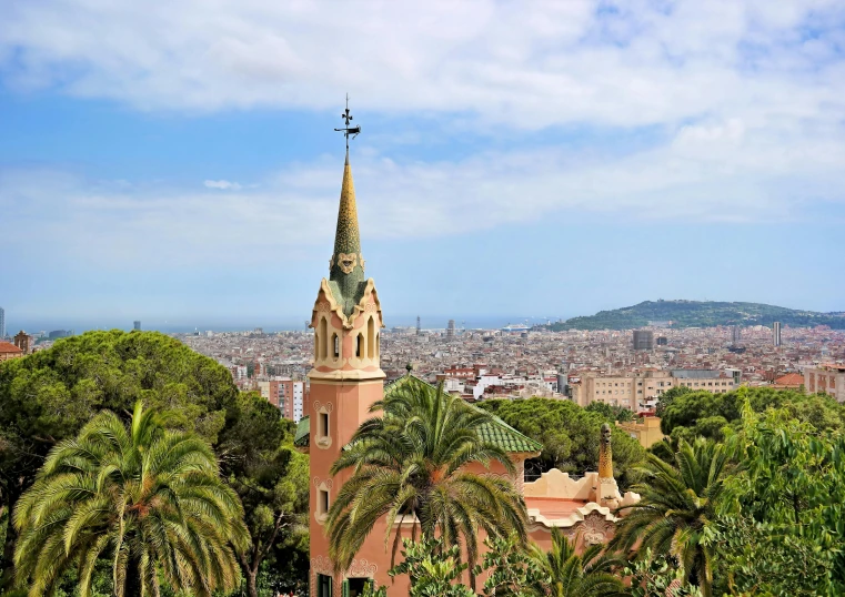 a view of the city of barcelona from the top of a hill, by Gaudi, pexels contest winner, art nouveau, palm trees in the background, pink, 2 0 0 0's photo, a green
