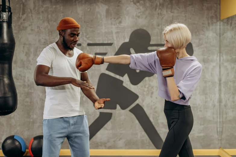 a man and woman boxing in a gym, by Arabella Rankin, pexels contest winner, interactive art, manuka, head to waist, thumbnail, round format