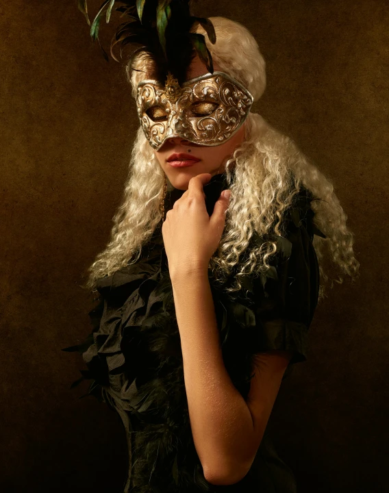 a woman wearing a mask with feathers on her head, an album cover, inspired by Hedi Xandt, trending on pexels, renaissance, dressed in a frilly ((lace)), non binary model, a man wearing golden mask, taken in the late 2010s