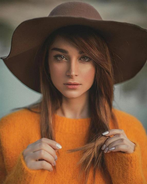 a woman wearing an orange sweater and a brown hat, a colorized photo, trending on pexels, pale-skinned persian girl, 5 0 0 px models, hair : long brown, queer woman