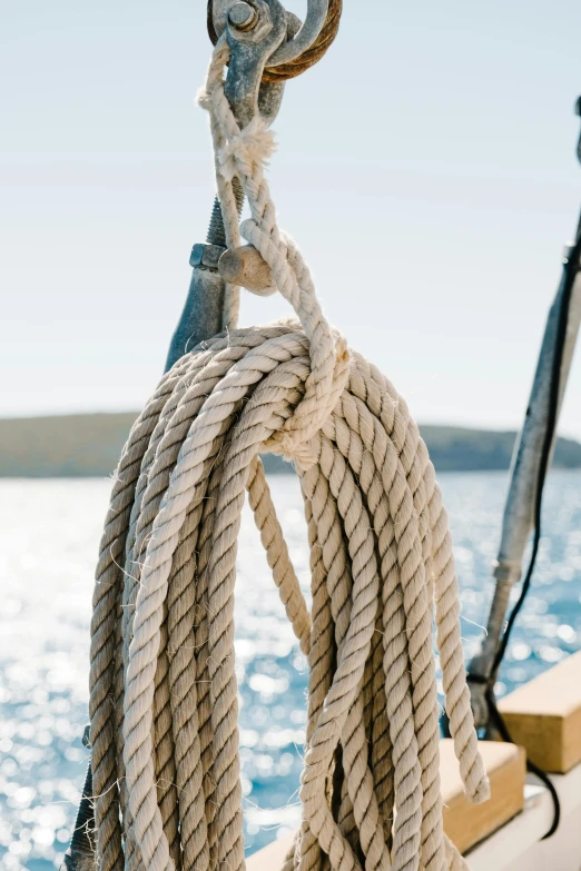 a close up of a rope on a boat, on the ocean, on a lake