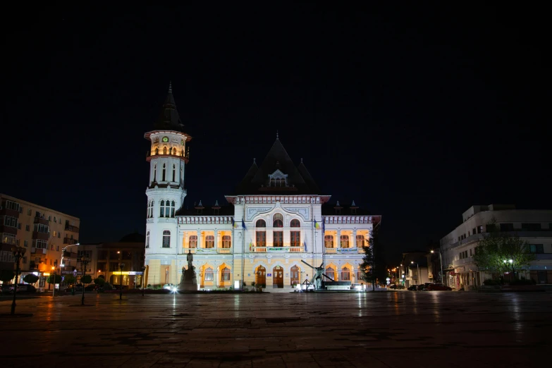 a large white building lit up at night, by Julia Pishtar, pexels contest winner, renaissance, town hall, tula, square, high quality photo