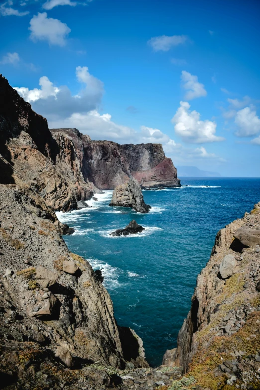 a view of the ocean from the top of a cliff, les nabis, tall spires, beautiful lava landscape, coastal cliffs, on display