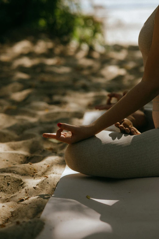 a woman is doing yoga on the beach, by Carey Morris, pexels contest winner, gnarly details soft light, low detail, paradise garden massage, brown