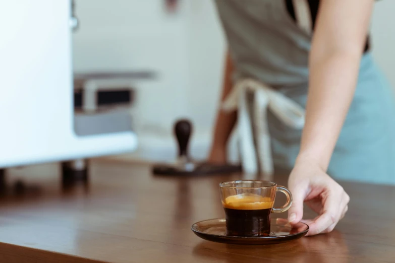 a close up of a person holding a cup of coffee, private press, aussie baristas, 2 - minute tabletop, no - text no - logo, small waist