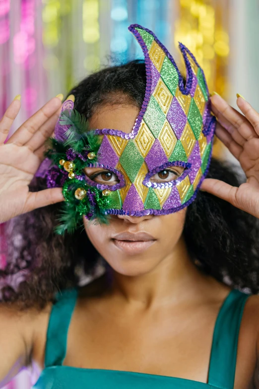 a woman putting a mardi gras mask on her face, trending on pexels, renaissance, front facing the camera, ashteroth, teenage girl, square