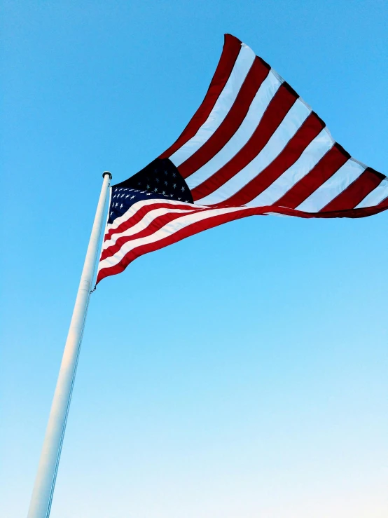 an american flag blowing in the wind on a sunny day, unsplash, square, cloudless sky, slide show, iphone picture