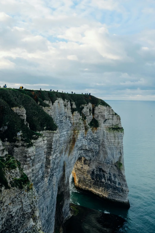 a lighthouse sitting on top of a cliff next to the ocean, normandy, sky bridge, slide show, gigapixel photo