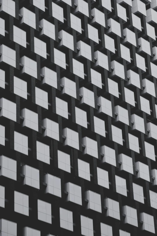 a black and white photo of a building, inspired by Andreas Gursky, unsplash, op art, square shapes, 8k detail, little windows, pixelsort