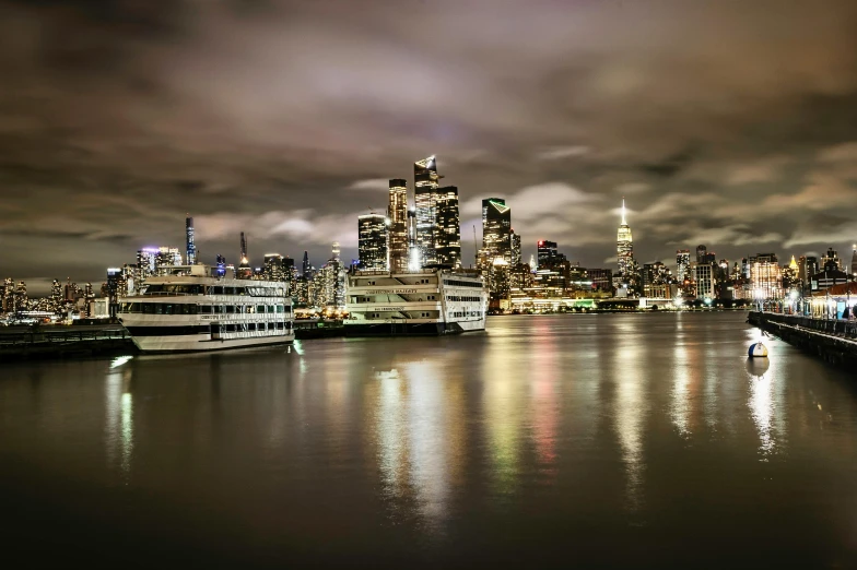 a large body of water with a city in the background, by Greg Rutkowski, pexels contest winner, romanticism, cloudy night, new jersey, victorian harbour night, exposure 1/40secs