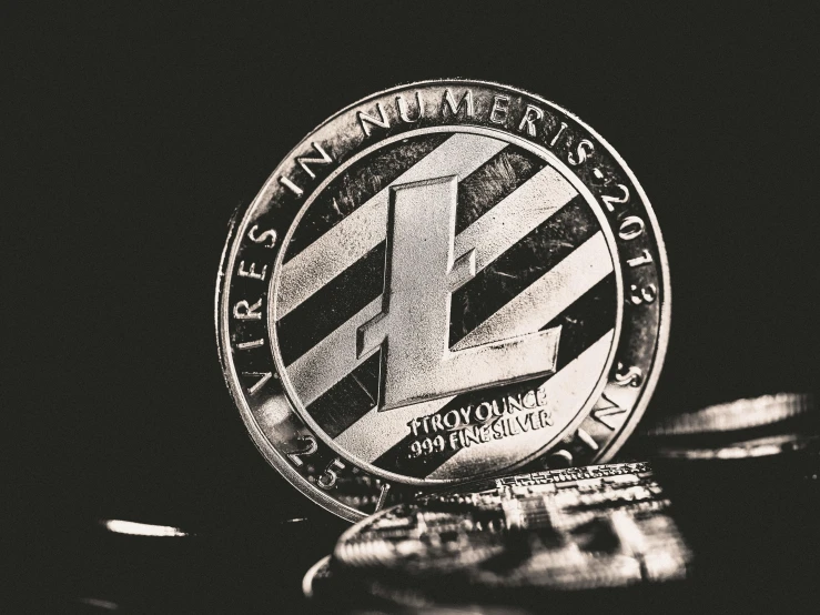 a coin sitting on top of a pile of coins, a black and white photo, unsplash, lyco art, silver insignia, l · lawliet, crypto, youtube thumbnail