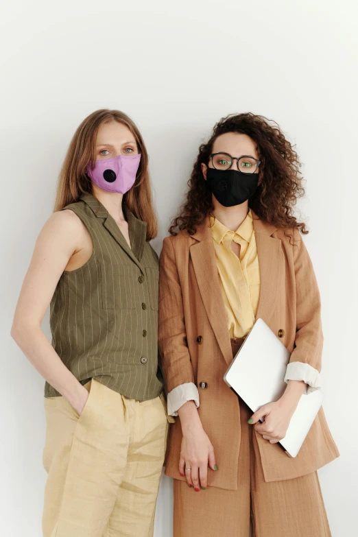 two women standing next to each other wearing masks, ((purple)), professional model, brown, neoprene