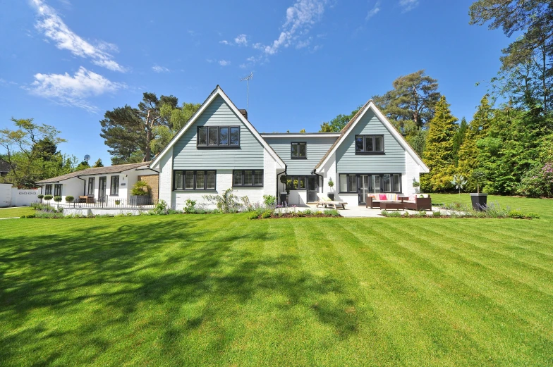 a large house sitting on top of a lush green field, pexels contest winner, an estate agent listing photo, crisp smooth clean lines, garden at home, thumbnail