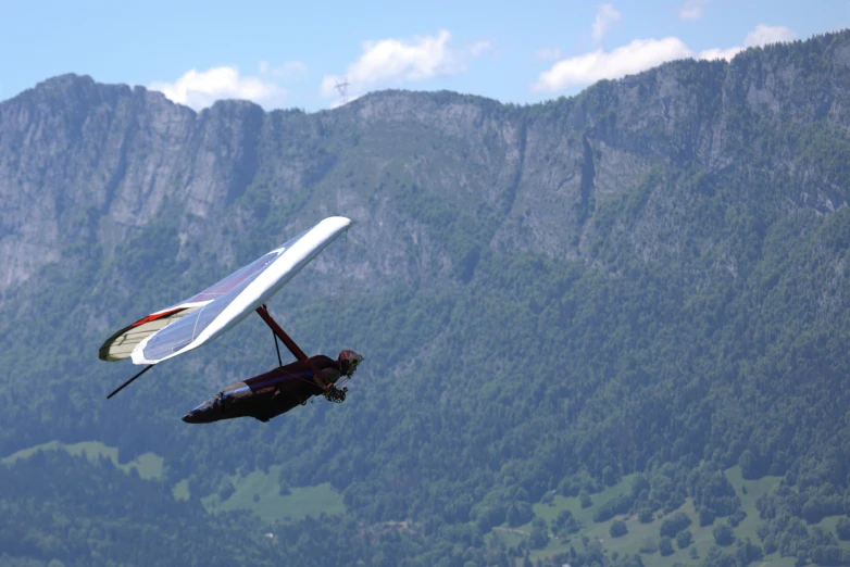 a person that is in the air with a hang glider, pexels contest winner, hurufiyya, the alps are in the background, avatar image, cessna glider plane, thumbnail