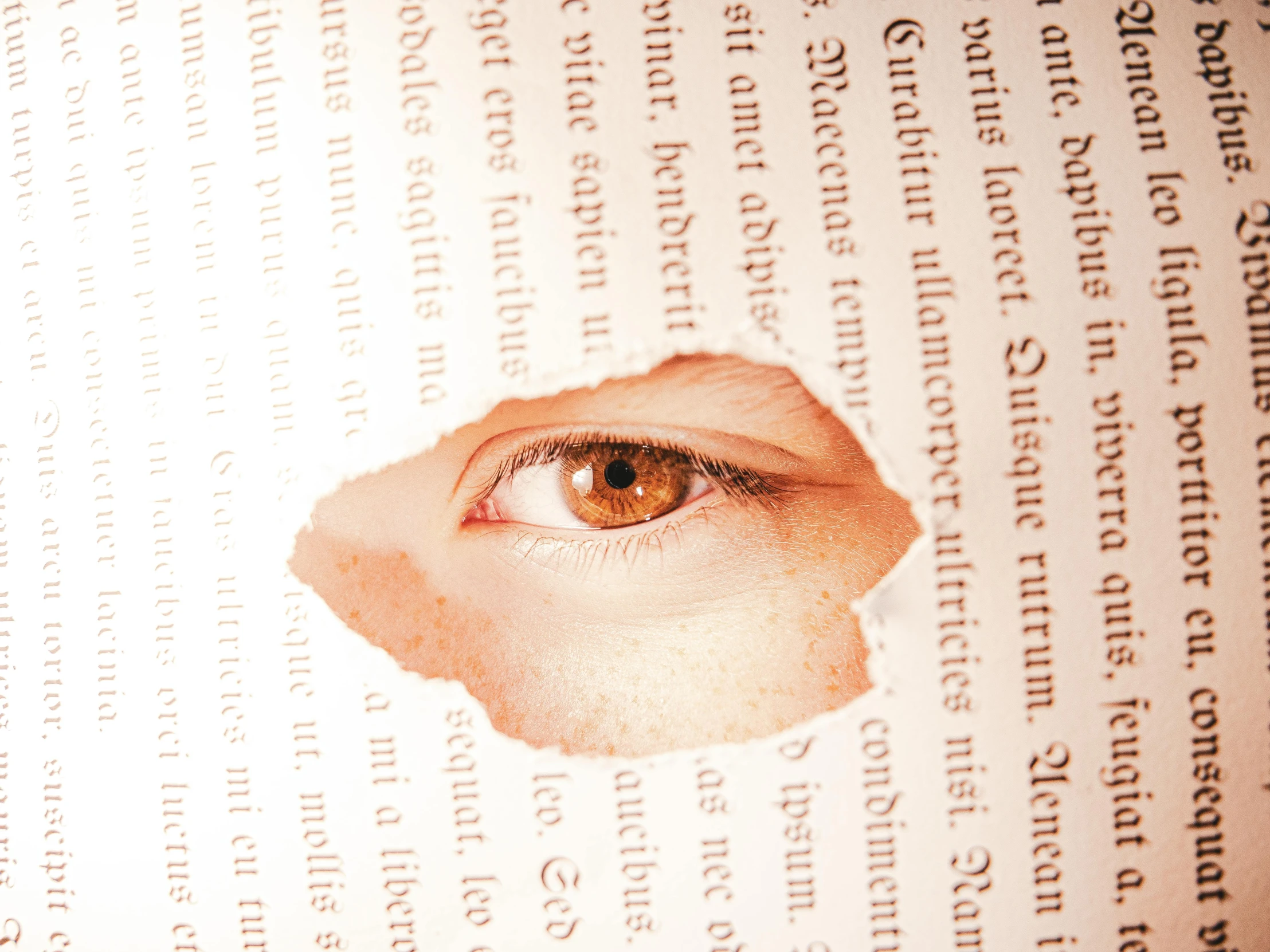 a person looking through a hole in a book, trending on pexels, hyperrealism, white around right eye, on parchment, wrinkles and muscle tissues, text and a pale young woman