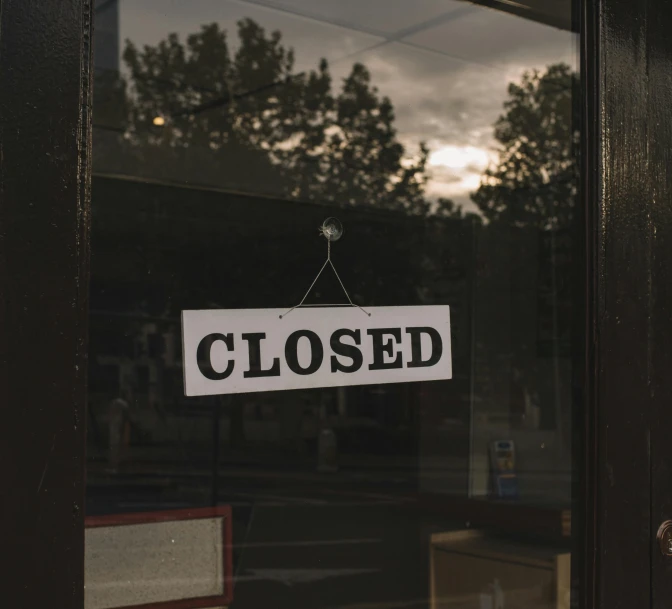 a close up of a closed sign on a door, a picture, pexels, shop front, background image, maintenance photo, opening shot