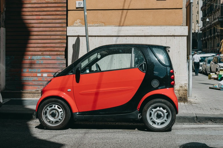 a small red and black car parked on the side of the road, pexels contest winner, les automatistes, smart design, square, orange red black white, a short and average built