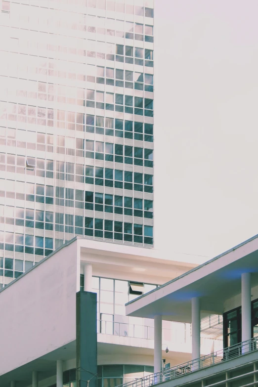 a man riding a skateboard up the side of a ramp, a screenshot, unsplash, modernism, office building, instagram story, the neat and dense buildings, seen from a distance