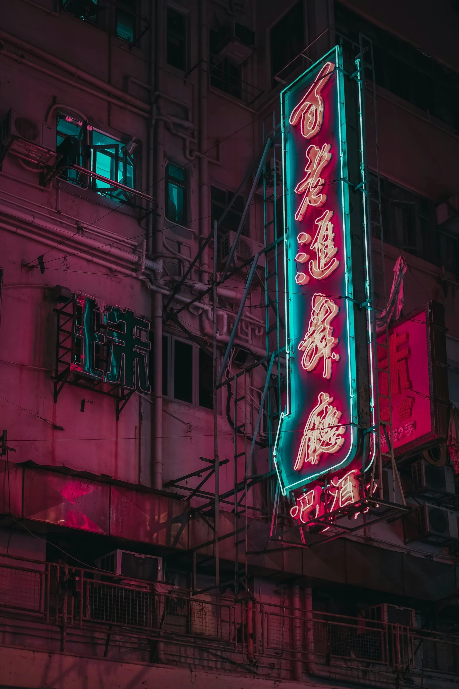 a neon sign hanging from the side of a building, inspired by Liam Wong, unsplash contest winner, chinese heritage, magenta and crimson and cyan, old signs, multiple stories