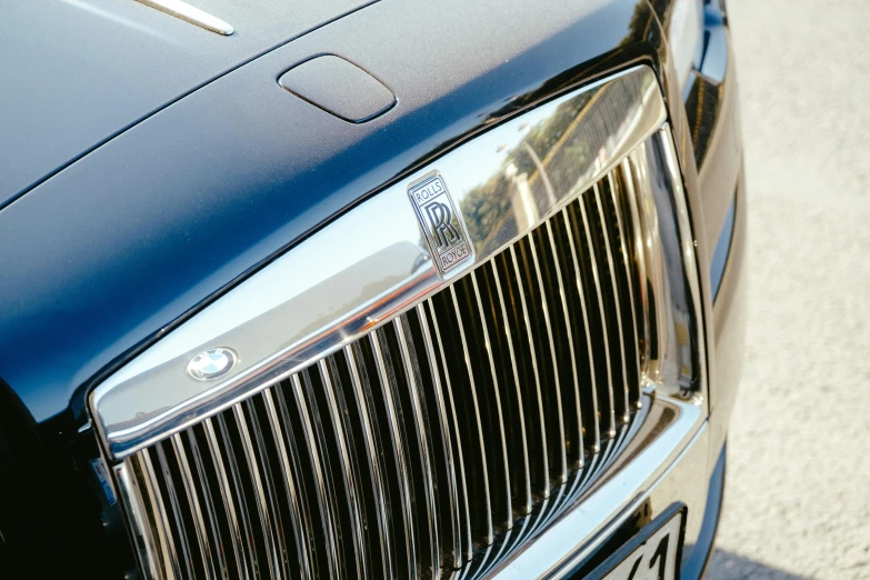 a close up of the front of a black car, renaissance, square, blue, shot with sony alpha 1 camera, wraith