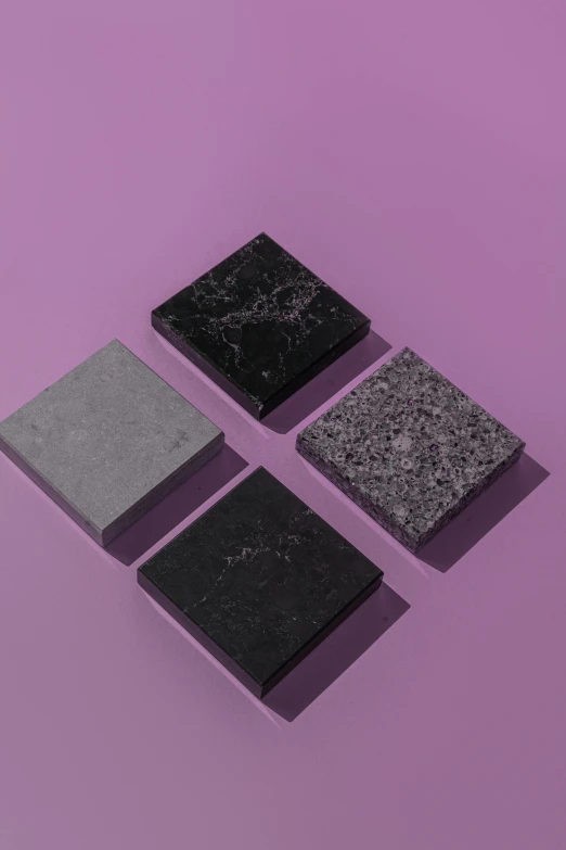 four pieces of black marble on a purple background, unsplash, square shapes, luxcore render, granite, vanilla