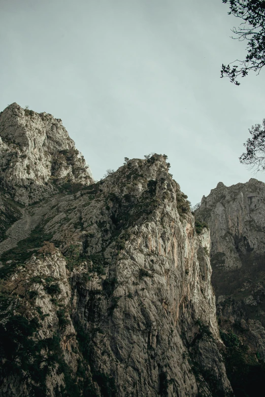 a couple of people standing on top of a mountain, seen from a distance, rugged textured face, monserrat gudiol, boka