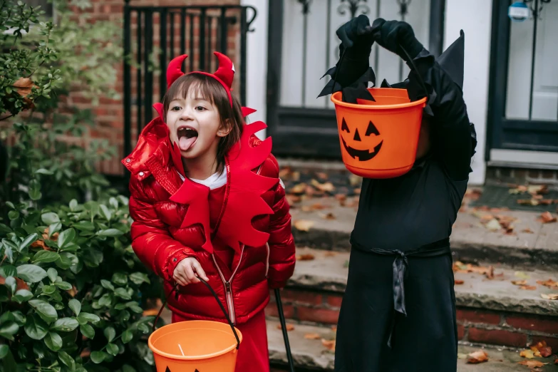 two young children dressed up in halloween costumes, by Helen Stevenson, pexels contest winner, the devil in hell as a dragon, gif, the gruffalo, children playing with pogs