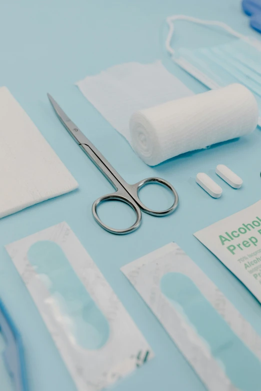 a variety of medical supplies laid out on a table, by Julian Allen, plasticien, blue soft details, thumbnail, up-close, crisp edges