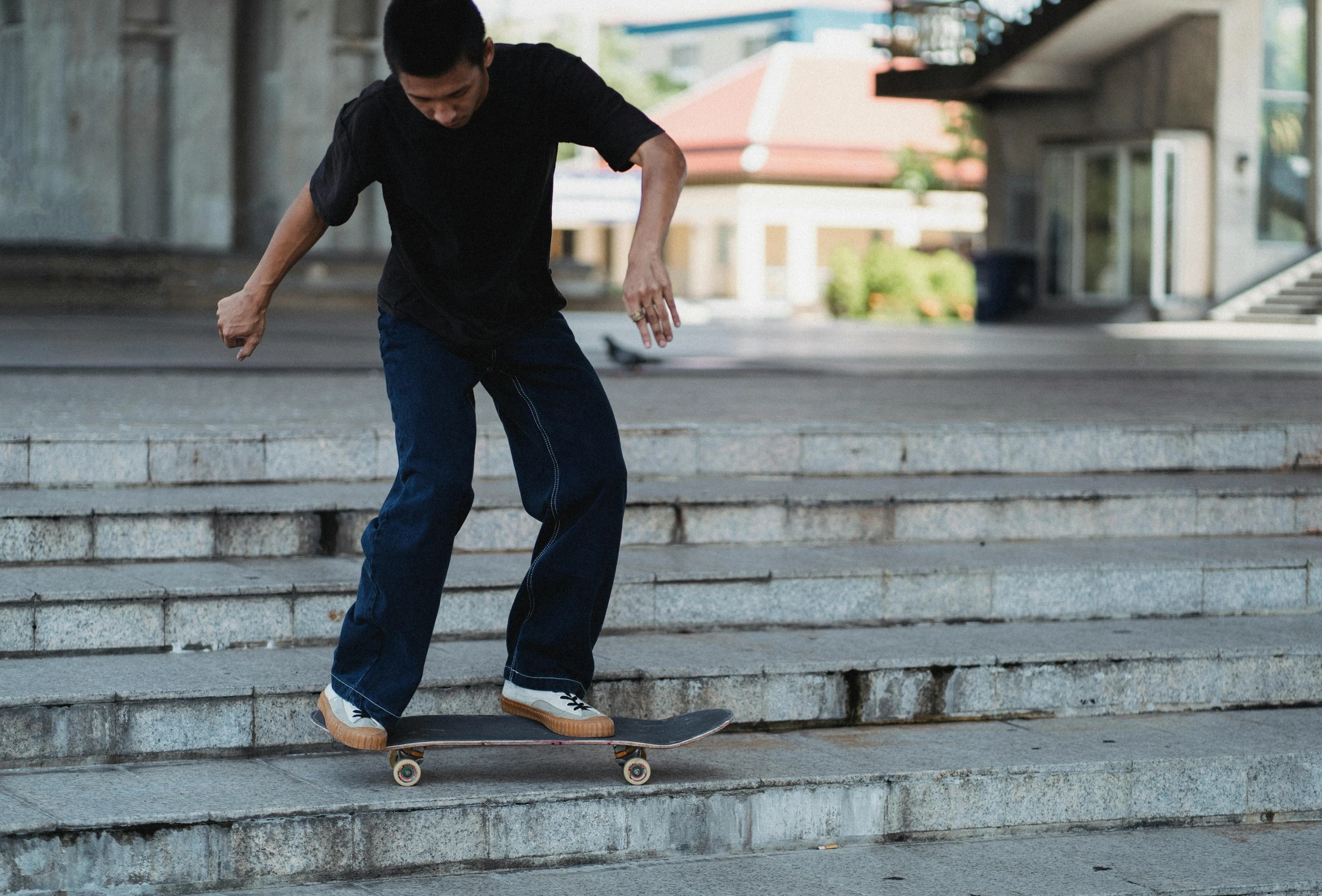 a young man riding a skateboard down some steps, pexels contest winner, realism, wearing a dark shirt and jeans, david luong, harriet tubman skateboarding, as well as scratches