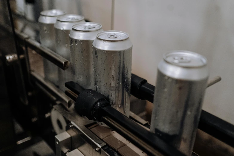 a line of cans on a conveyor belt, pexels contest winner, bitches brew, steel plating, subtle details, 6 pack