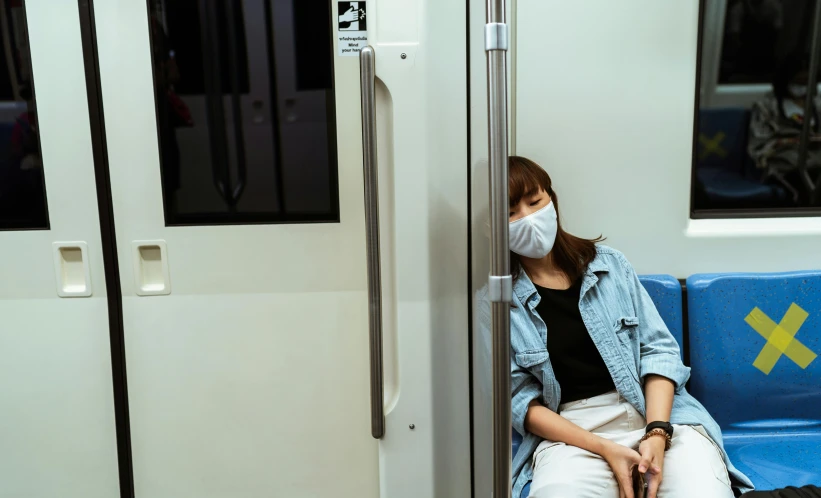 a woman wearing a face mask sitting on a train, pexels contest winner, shin hanga, square, sleeping, plain background, 🚿🗝📝