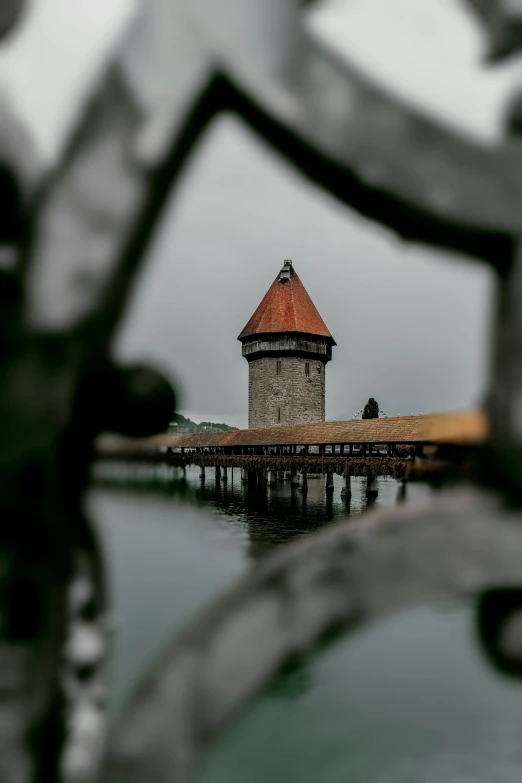 a clock tower in the middle of a body of water, on a bridge, northern renaissance, hasselblad, high quality picture