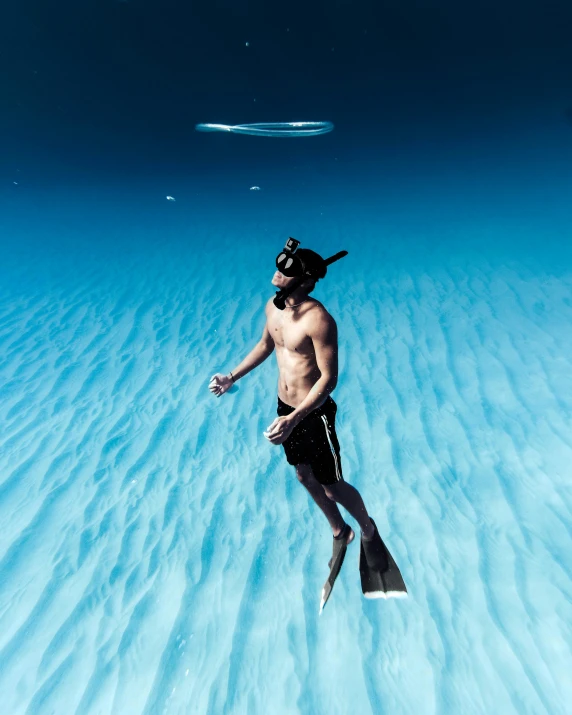 a man that is in the water with a snorg, unsplash contest winner, epic blue sky, conde nast traveler photo, seapunk, 5 0 0 px